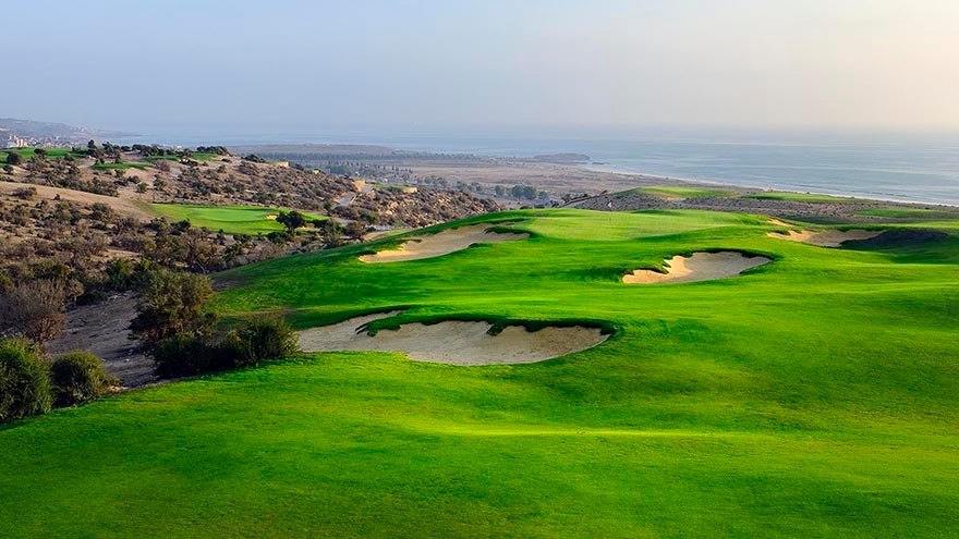 Aerial view of fairway bunkers overlooking the ocean and green at Taghazout.