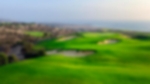 Aerial view of fairway bunkers overlooking the ocean and green at Taghazout.