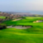 Aerial view of fairway bunkers overlooking the ocean and green at Taghazout.