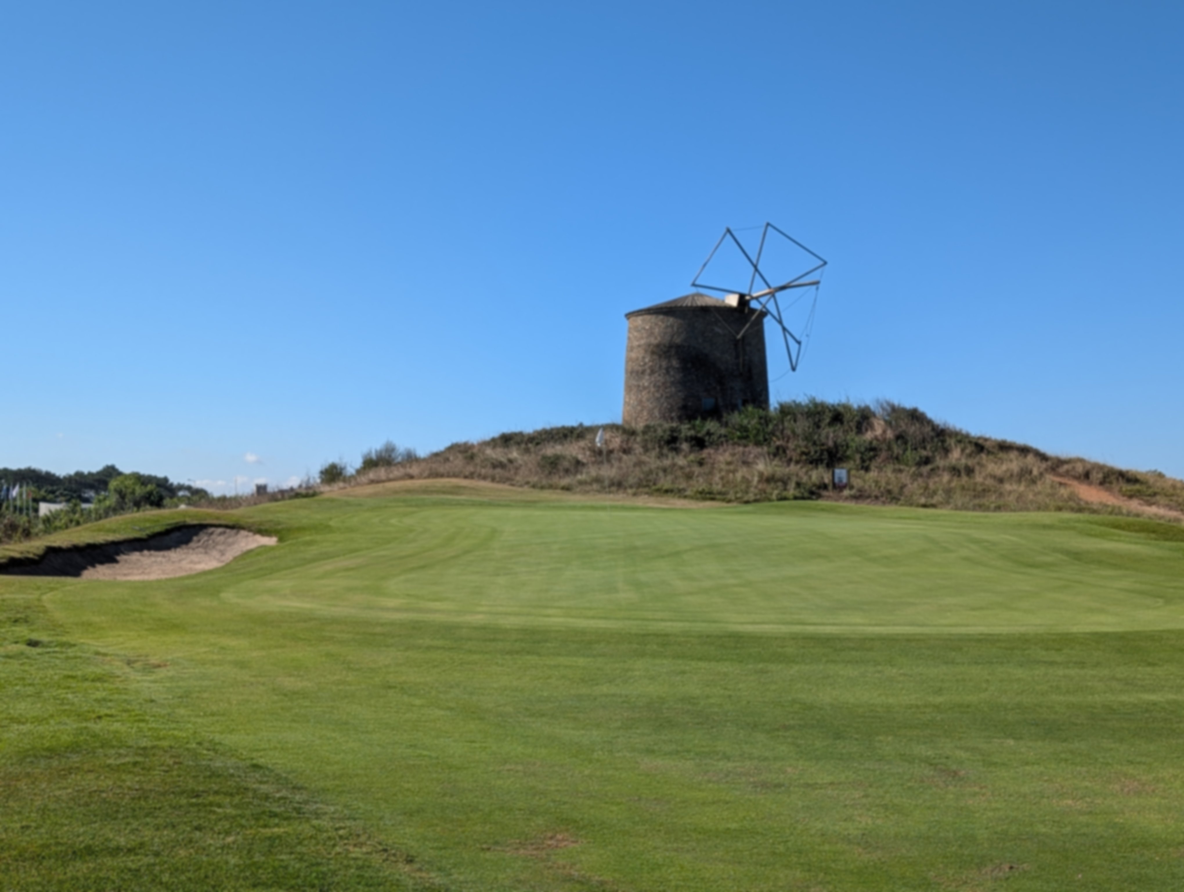 Green on Estela Golf Course with a windmill