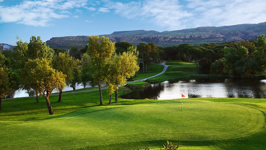 Scenic water fronted green at Golf de Saint Endreol.