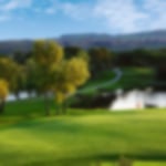 Scenic water fronted green at Golf de Saint Endreol.