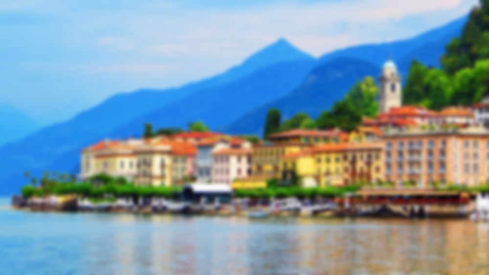 Lakeside houses and with mountainous surroundings