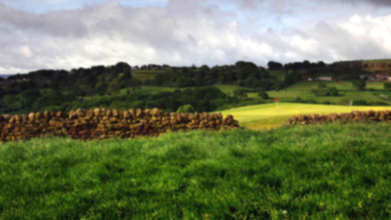 Rock wall with hilly surroundings