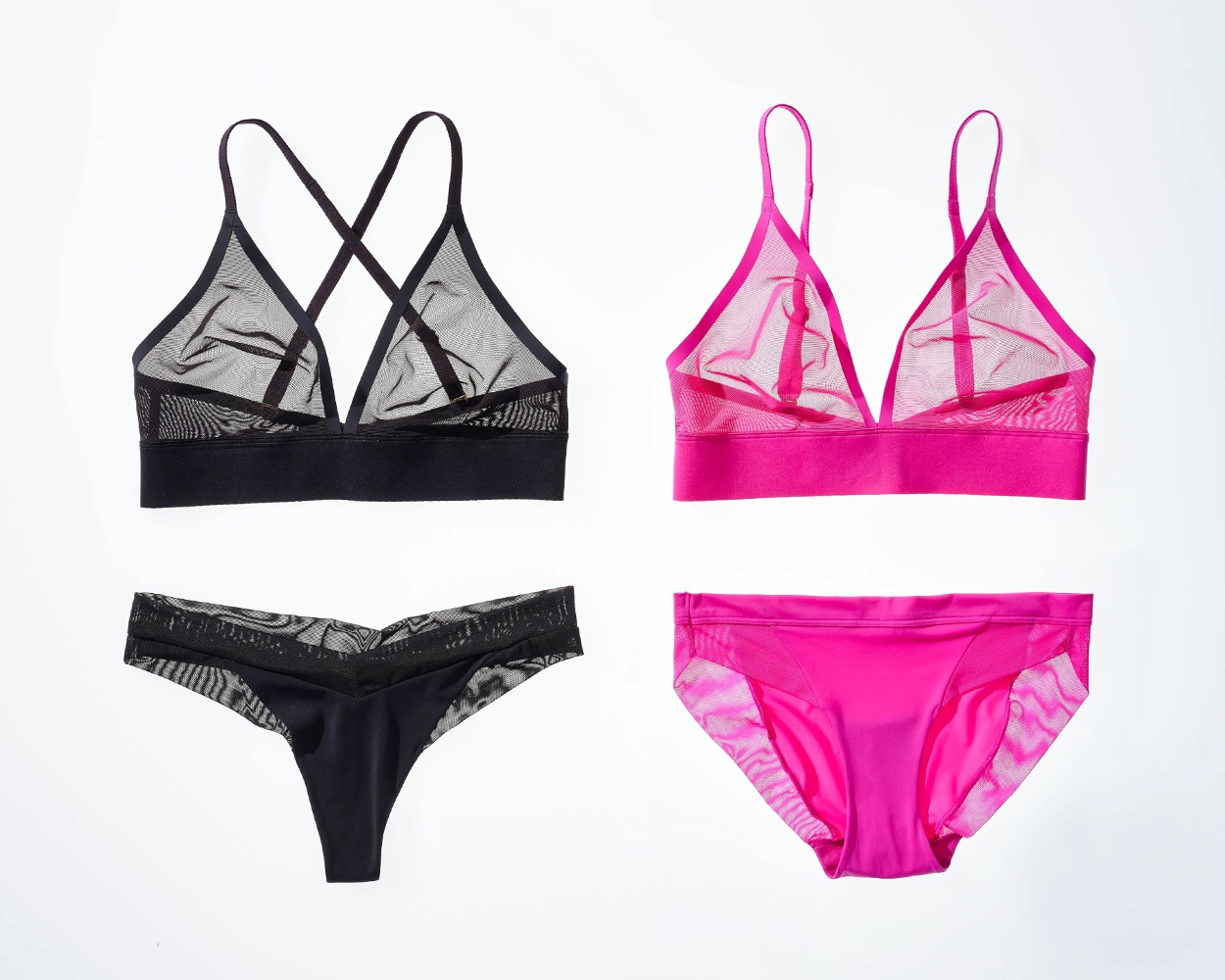 Soma<sup class=st-superscript>®</sup> laydown of sheer mesh triangle bralettes in pink and black with matching black thong and pink bikini panties.