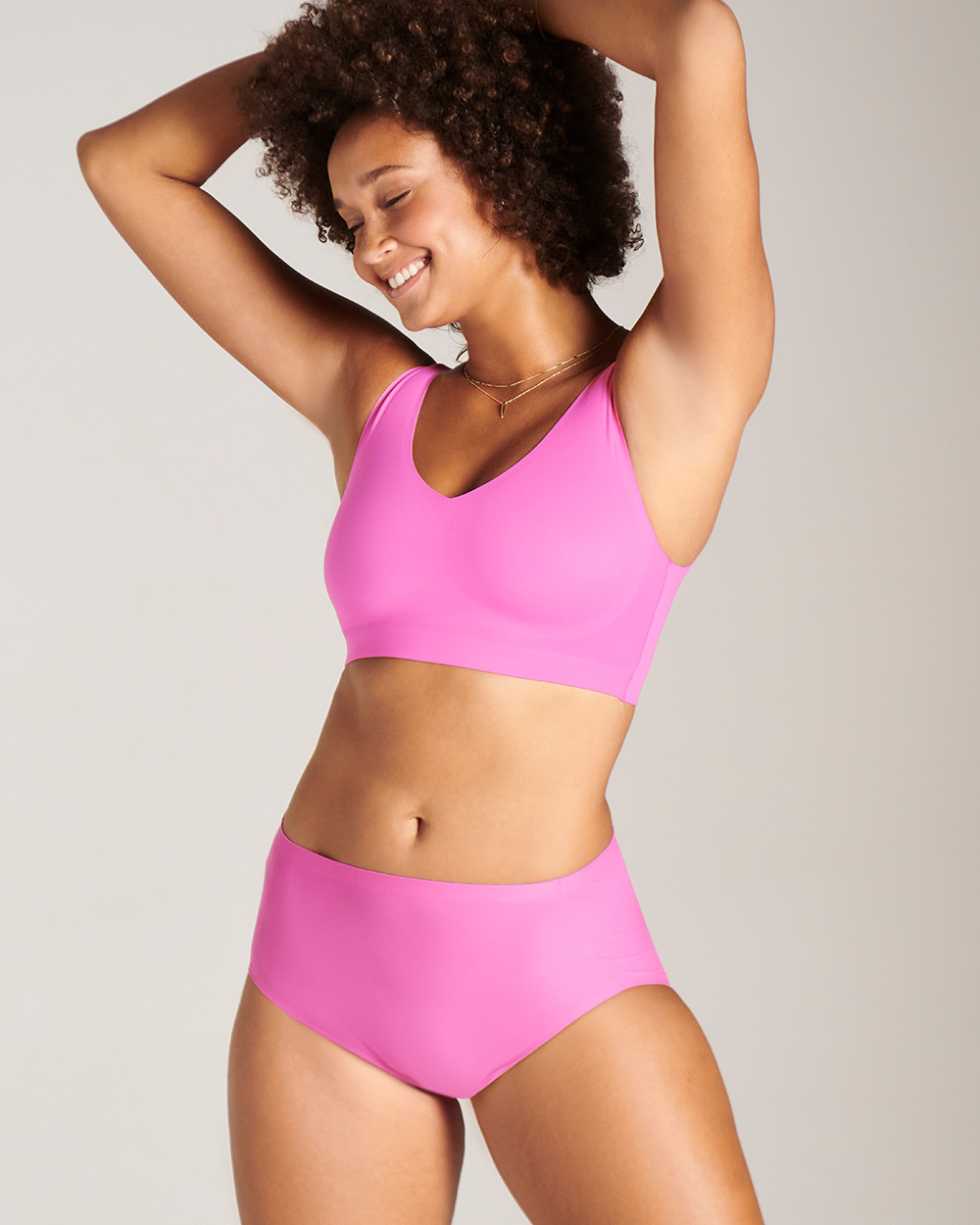 Soma<sup class=st-superscript>®</sup> model wearing a pink bralette and matching brief panties.