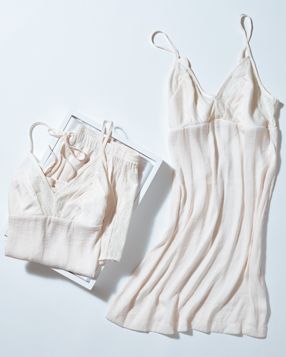 Soma<sup class=st-superscript>®</sup> laydown of open gift box, ivory satin shorts, cami, and chemise.