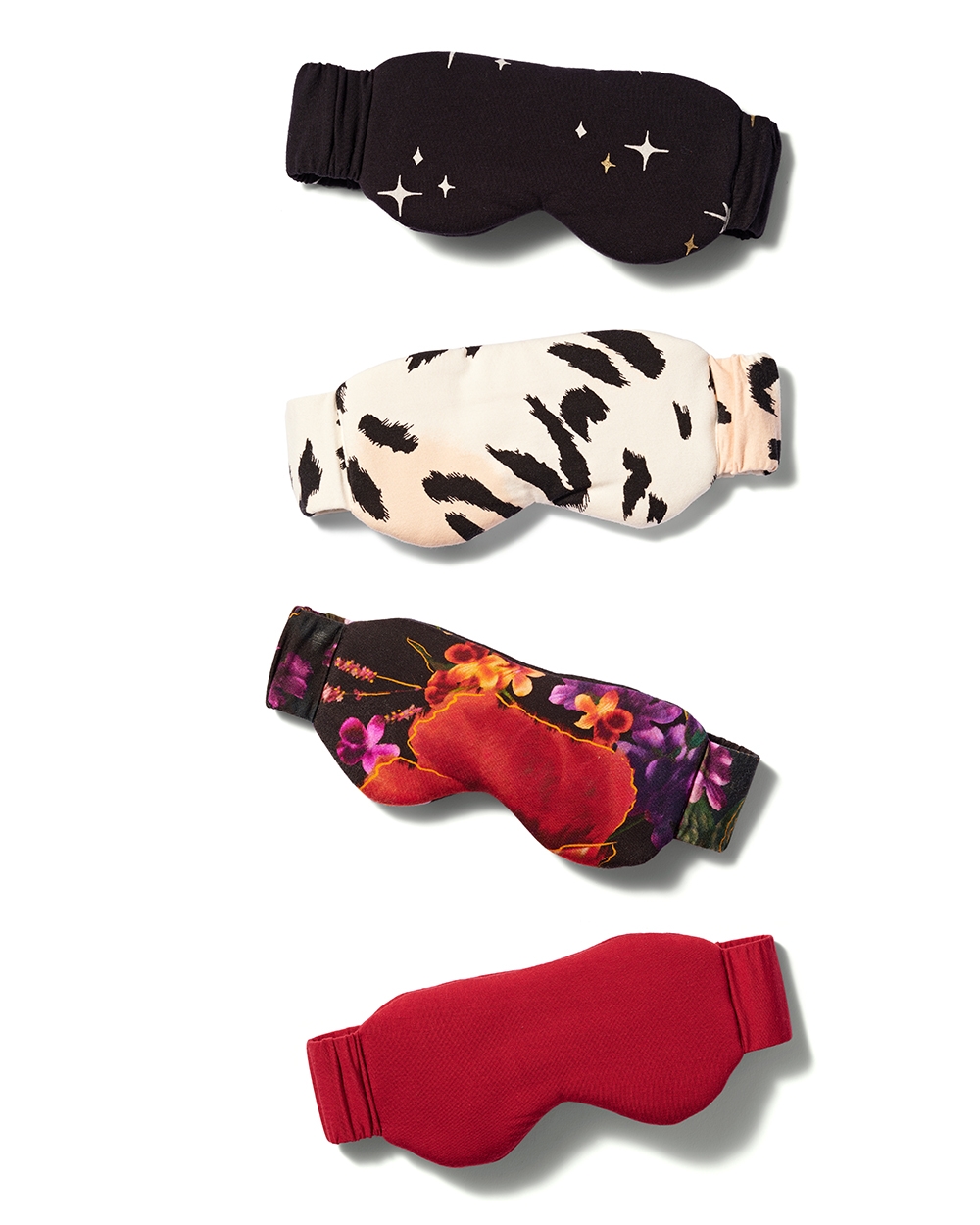 Soma<sup class=st-superscript>®</sup> laydown of black star print, white animal print, black floral print, and solid red eye masks.
