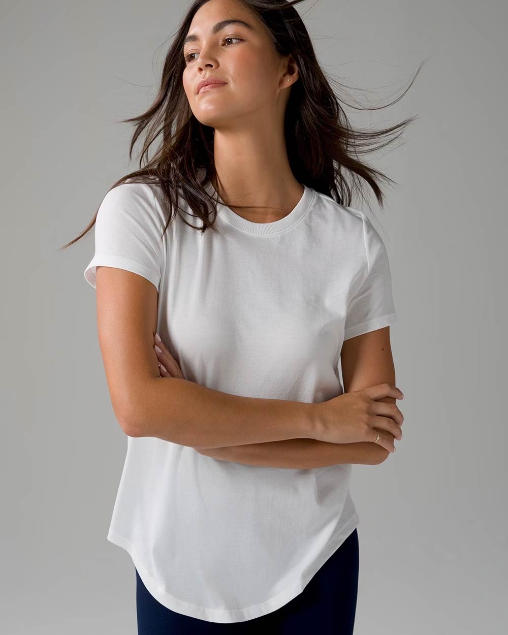 Soma<sup class=st-superscript>®</sup> women’s model wearing a white T-shirt and black pants.