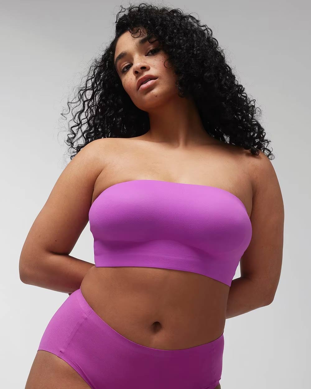 Soma<sup class=st-superscript>®</sup> women’s model wearing a purple bandeau bra.