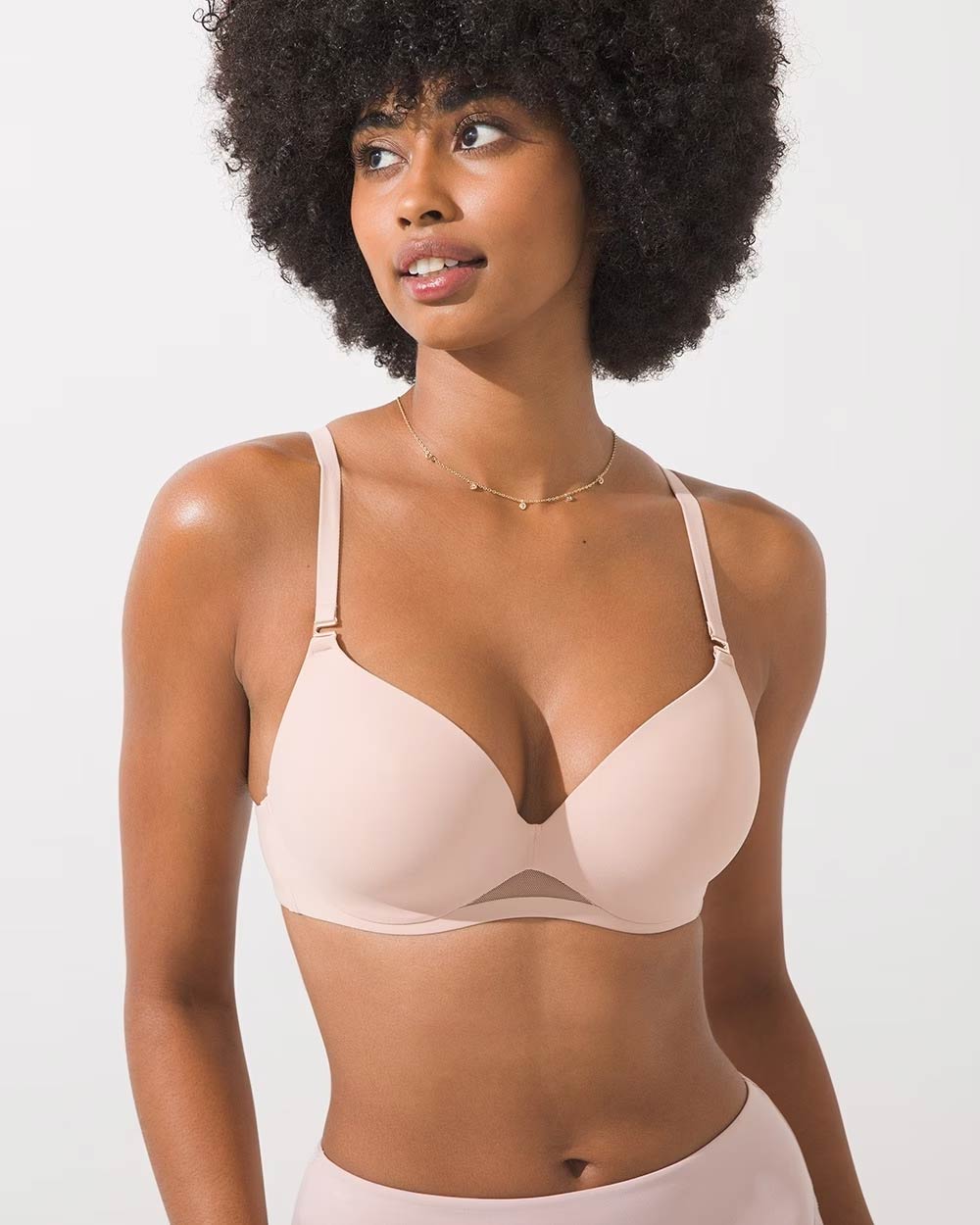 Soma<sup class=st-superscript>®</sup> women’s model wearing a light nude bra and panties, and gold charm necklace.