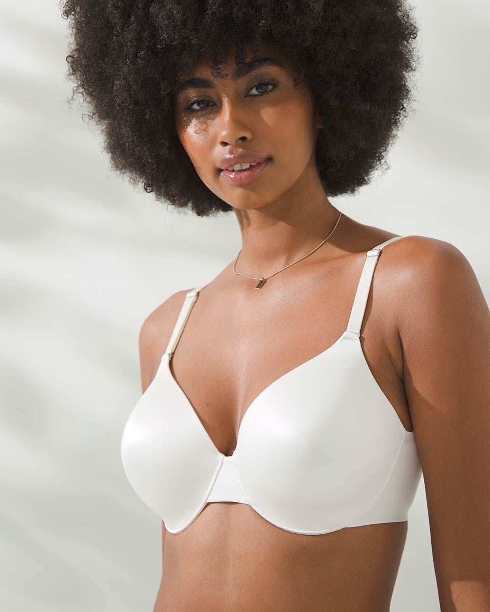 Soma<sup class=st-superscript>®</sup> women’s model wearing a white a full coverage smoothing bra.