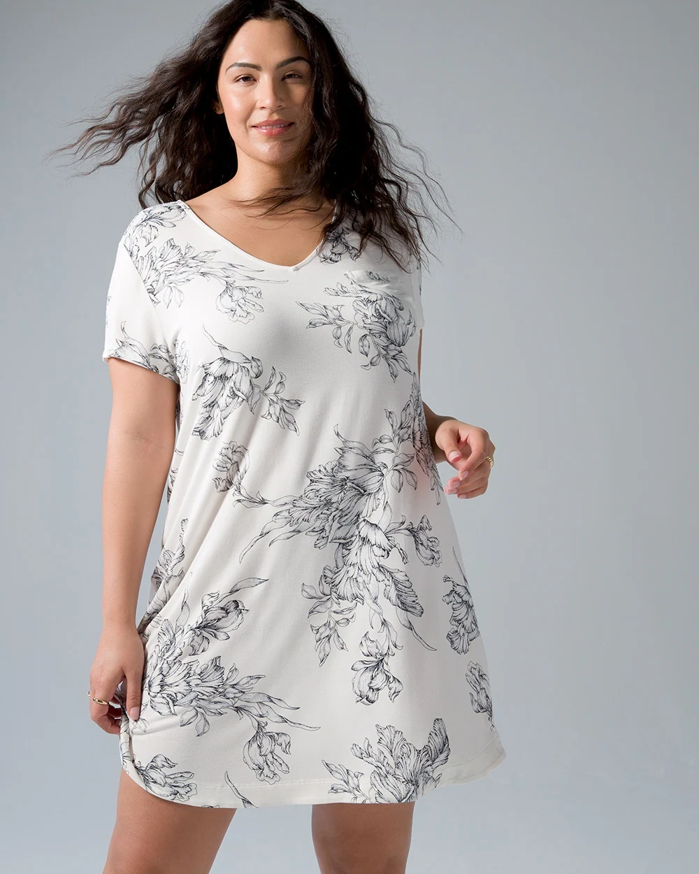 Soma<sup class=st-superscript>®</sup> women's model wearing a white and black floral short-sleeve sleep shirt.