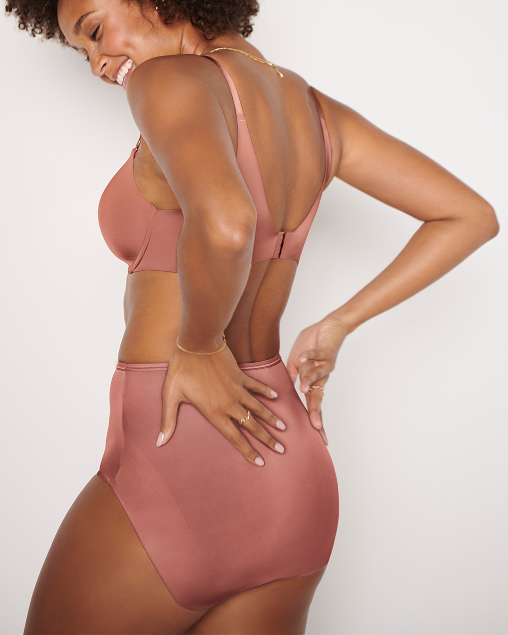 Soma<sup class=st-superscript>®</sup> model wearing dark pink bra and high-rise dark pink brief panties.
