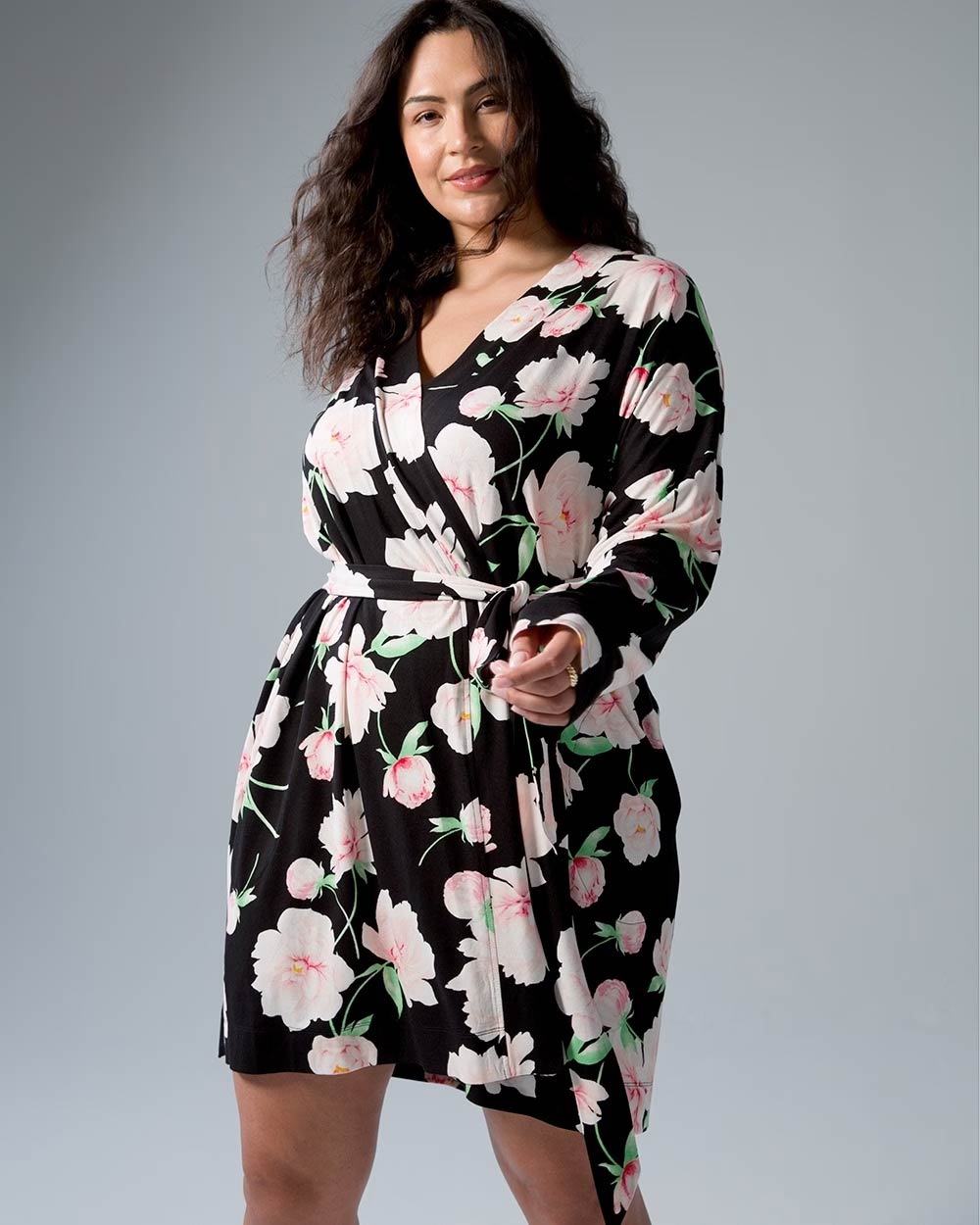 Soma<sup class=st-superscript>®</sup> women’s model wearing a black, pink, and green floral robe.