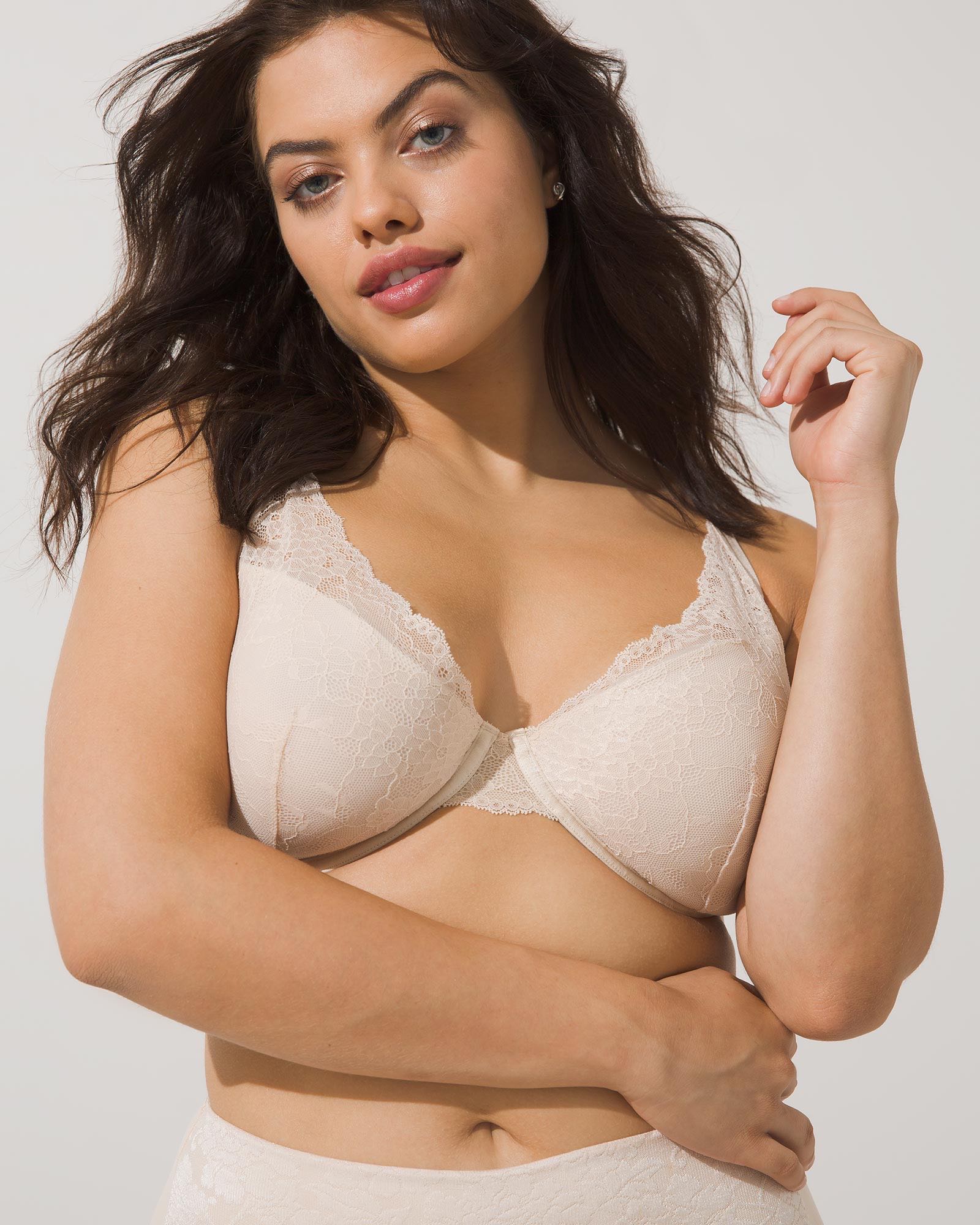 Soma<sup class=st-superscript>®</sup> women’s model wearing an ivory lace plunge bra.