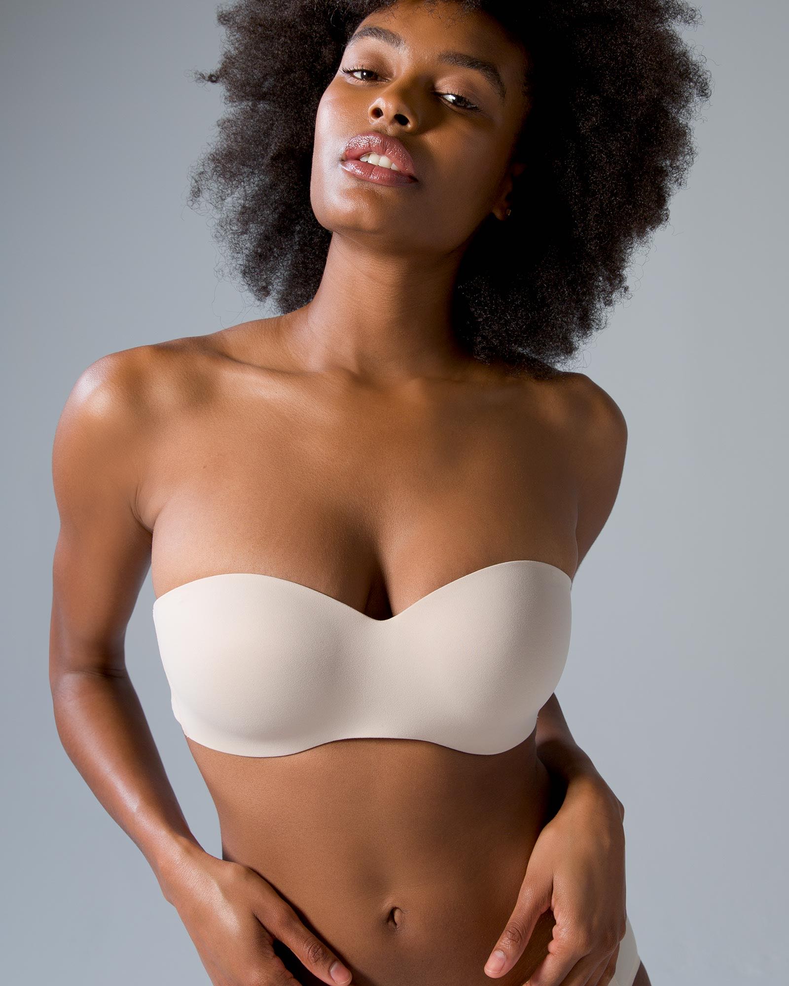 Soma<sup class=st-superscript>®</sup> women’s model wearing a nude wireless strapless bra.