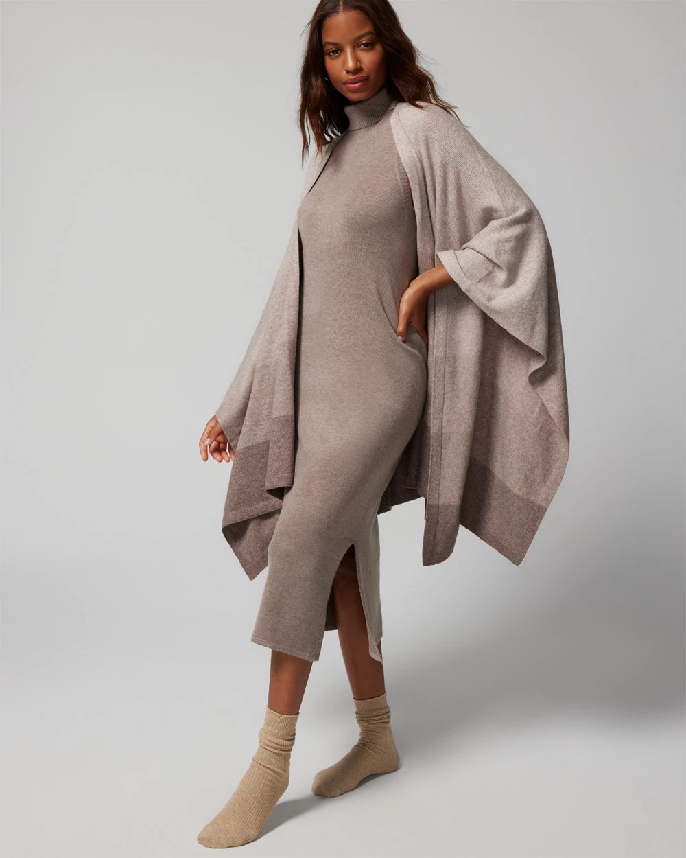 Soma<sup class=st-superscript>®</sup> model wearing taupe sweater dress, ombre wrap sweater, and light brown slouchy socks.