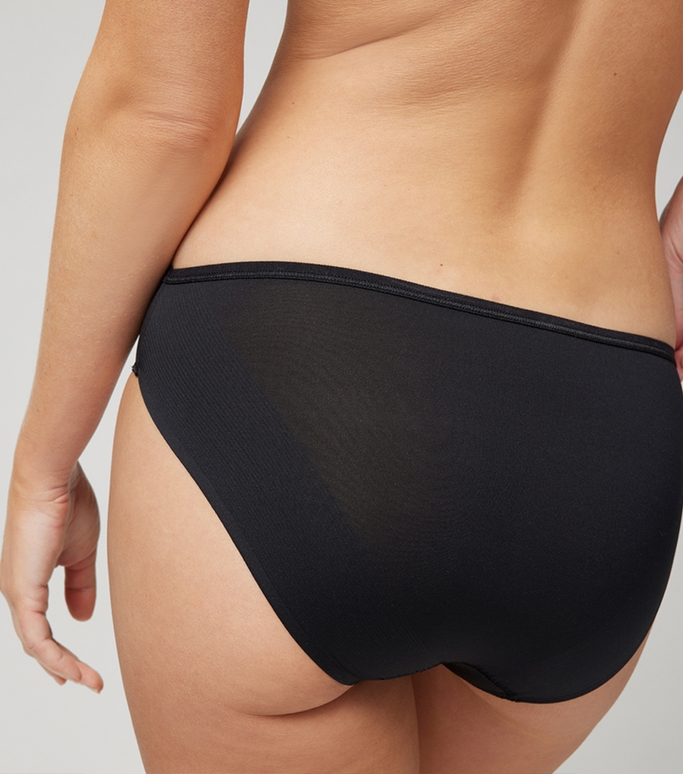 Soma<sup class=st-superscript>®</sup> women’s model wearing a black hipster panty.