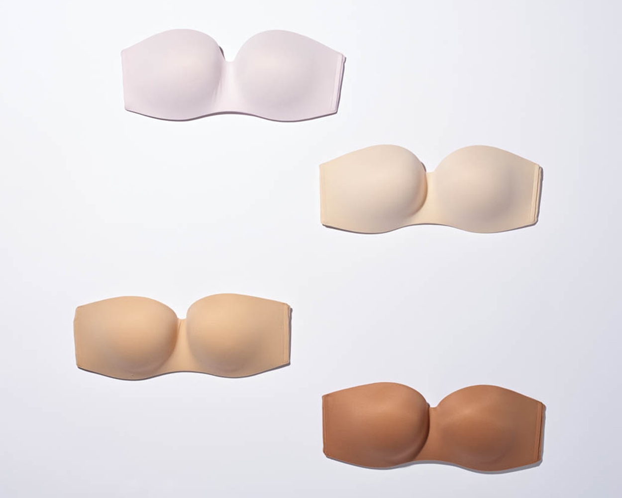 Soma<sup class=st-superscript>®</sup> laydown of strapless bras in various nude shades.