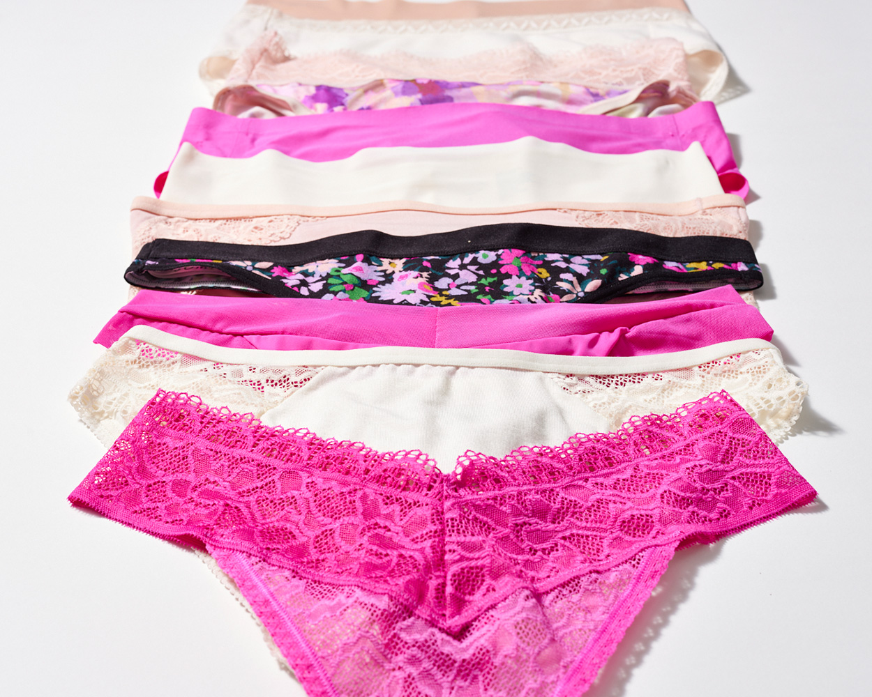 Soma<sup class=st-superscript>®</sup> cascading laydown of pink, white, light pink, and black printed panties in a variety of silhouettes.