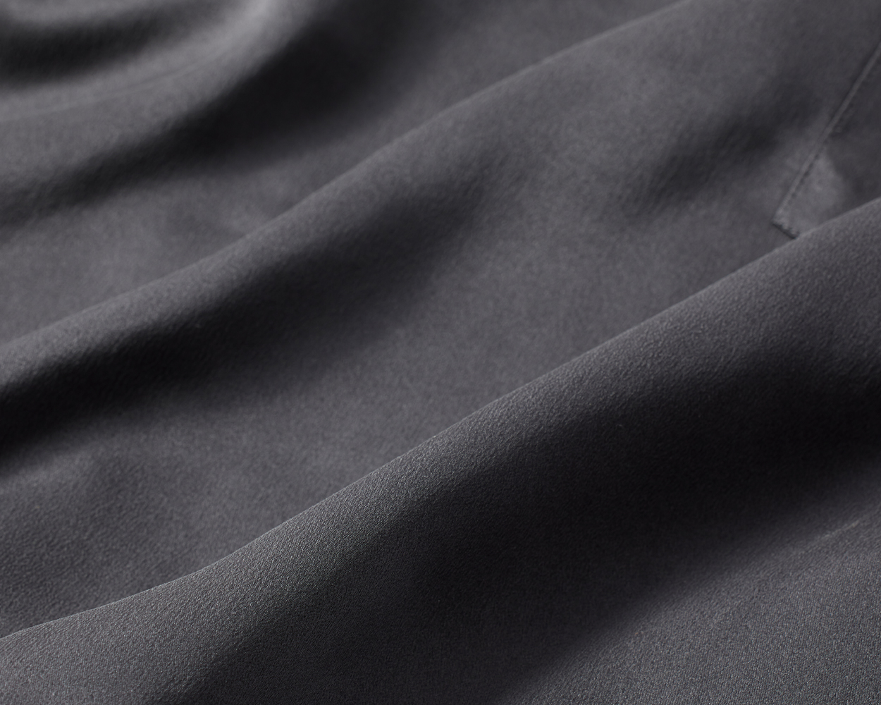 Close-up shot of dark grey Soma<sup class=st-superscript>®</sup> washable silk fabric.