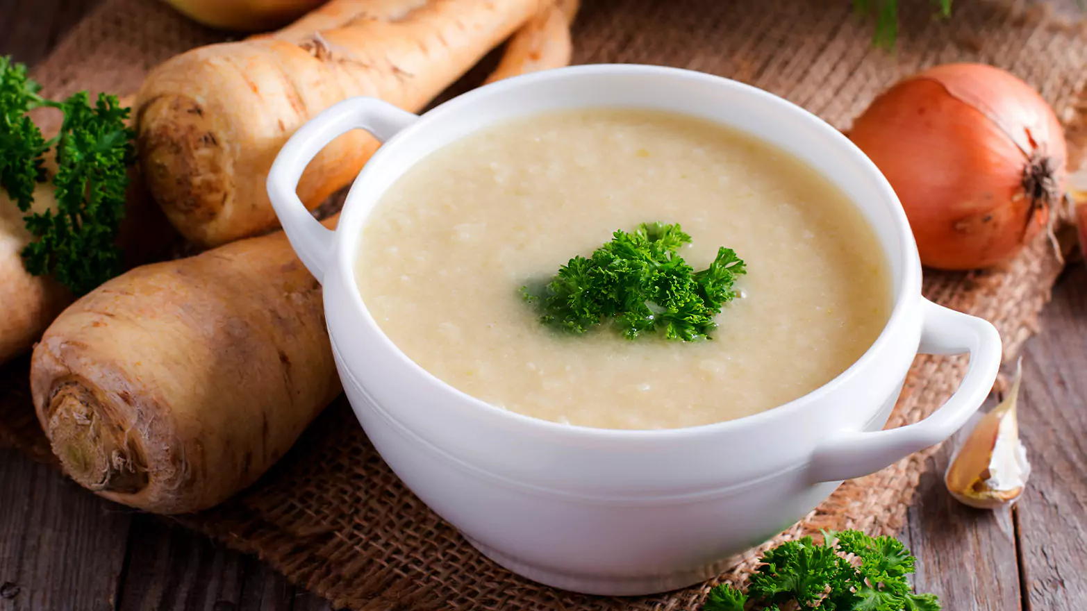 A bowl of creamy parsnip soup.