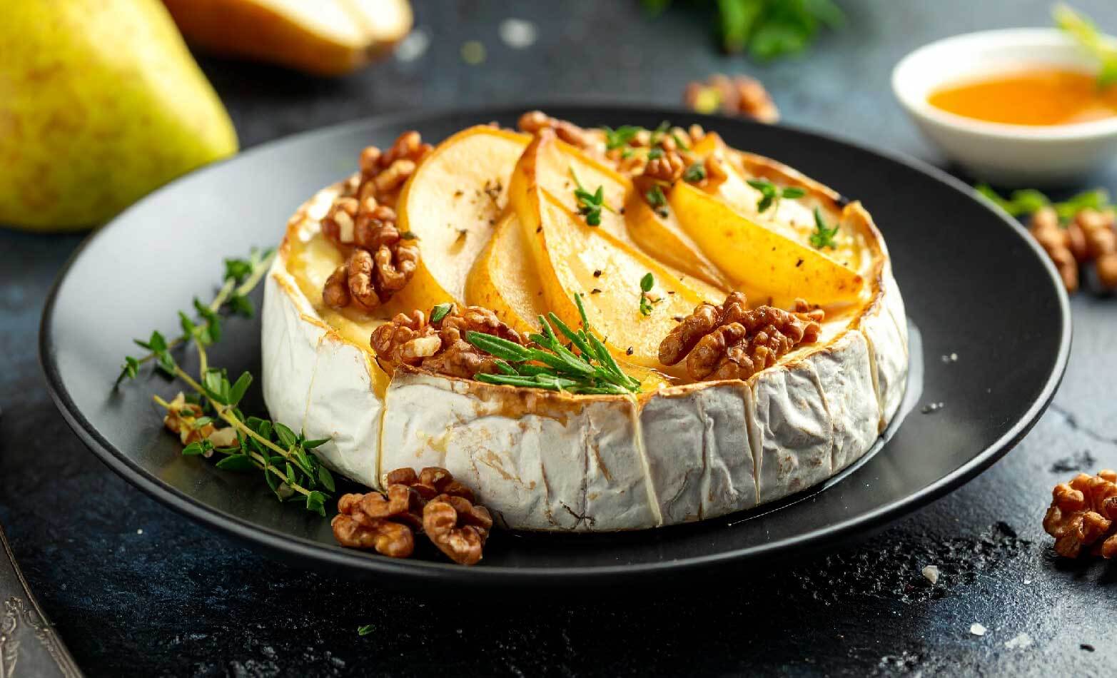 a stock photo of baked brie