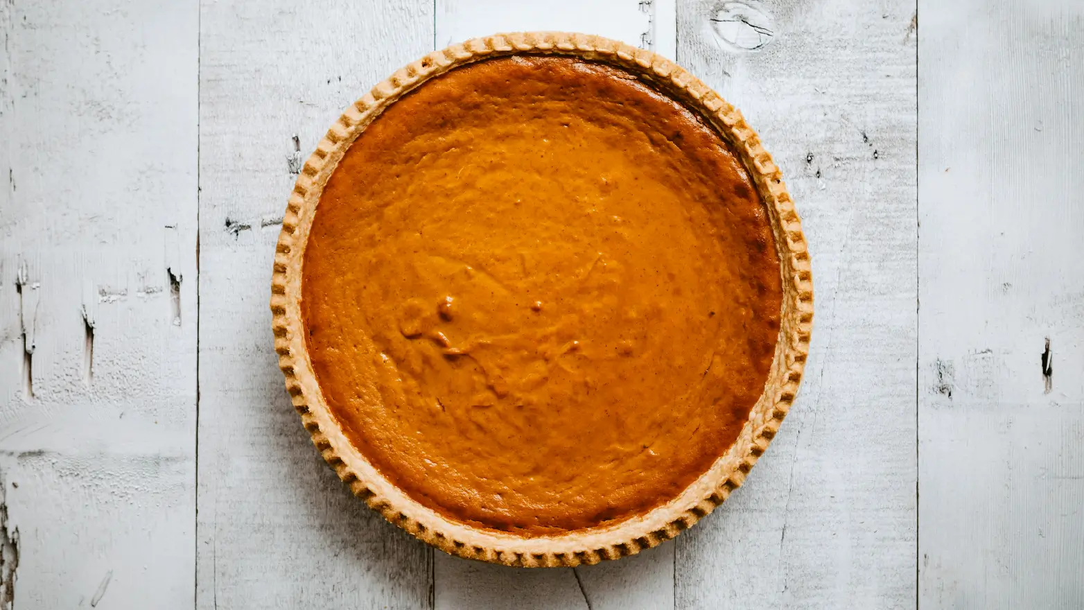 a close-up photo of a pumpkin pie