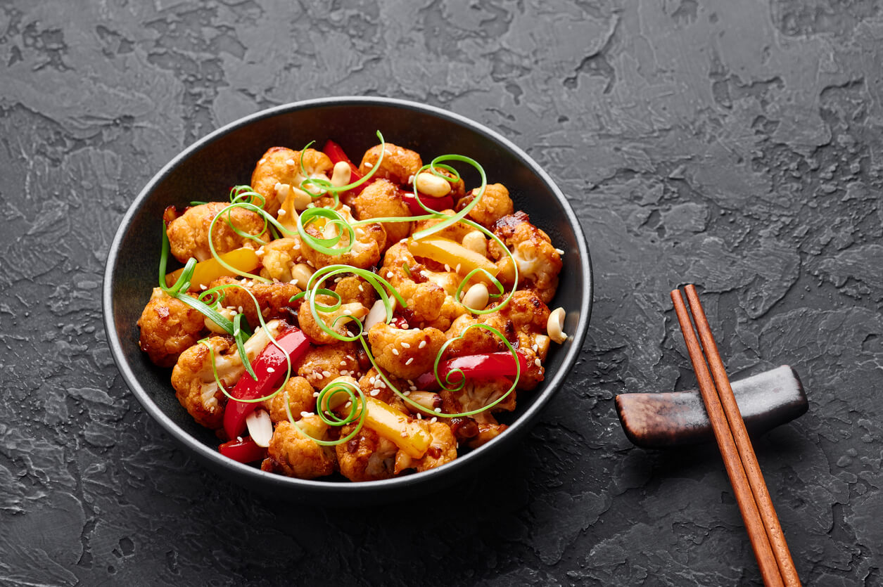 Kung Pao Cauliflower on dark slate background.
