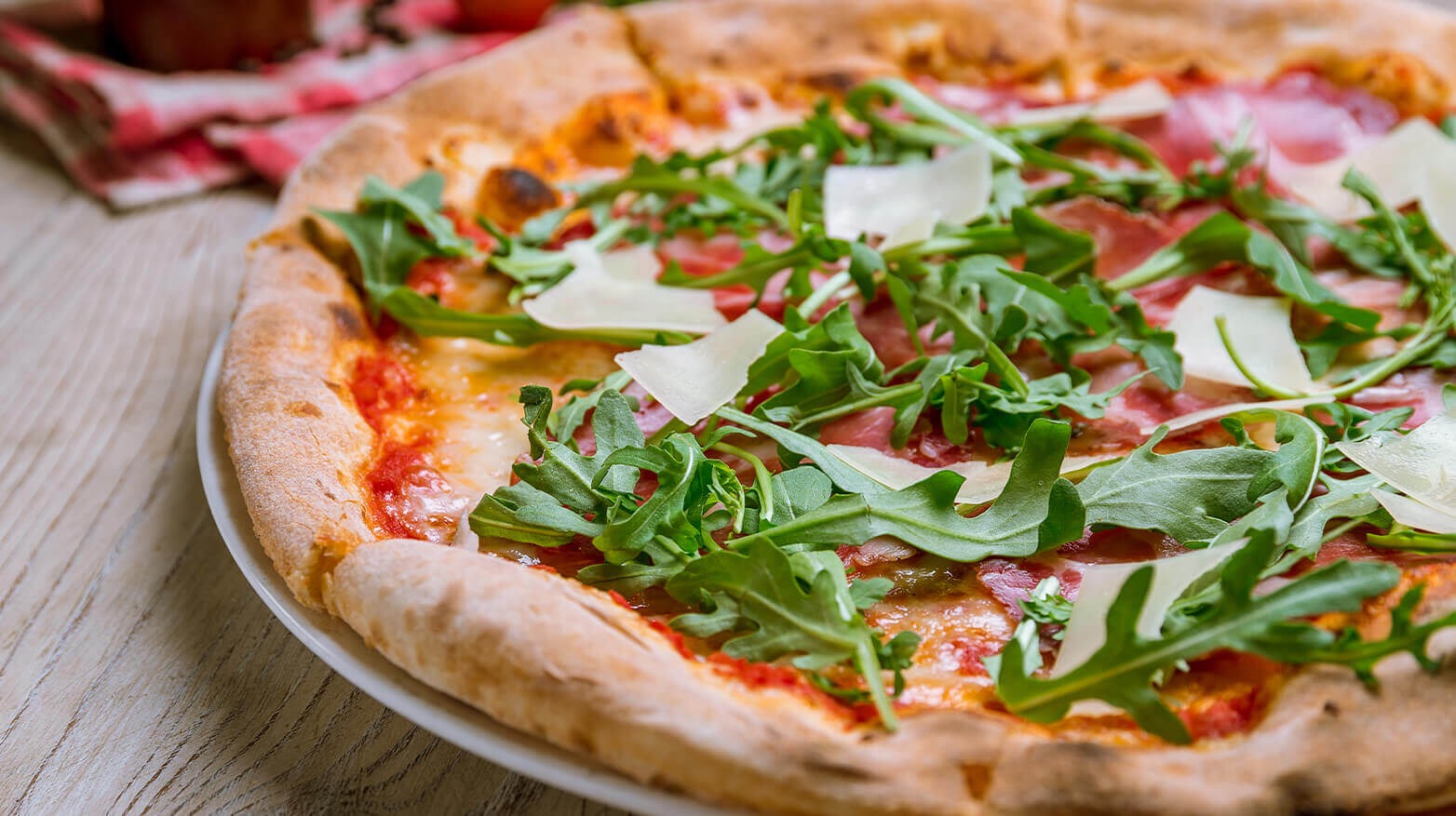 Pizza topped with arugula