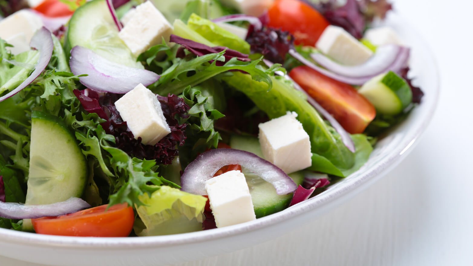 Green salad with feta and red onion