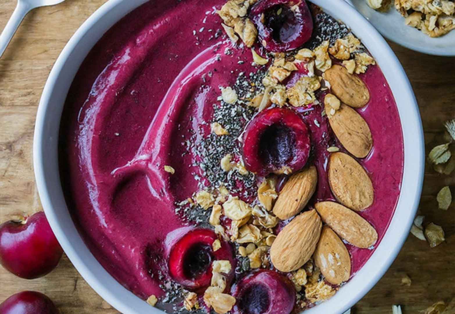 Cherry almond smoothie bowl with granola and chia