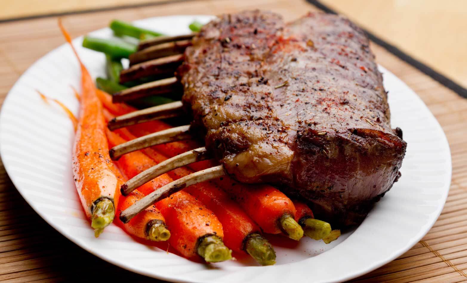 a stock photo of grilled rack of lamb