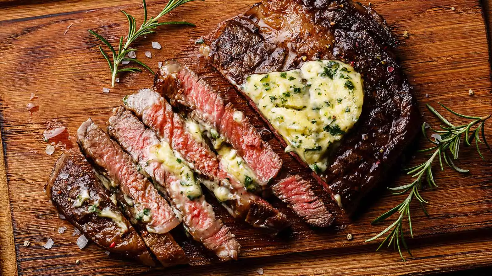 Sliced steak topped with herb butter