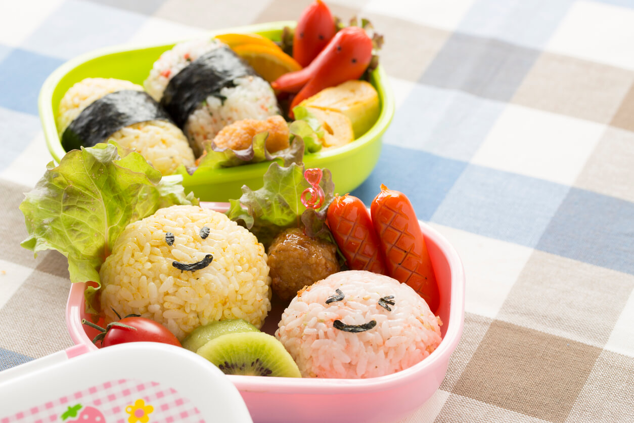 bento box with cute rice faces.