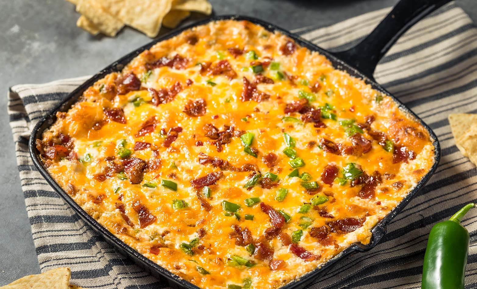 a warm serving dish of jalapeno popper dip