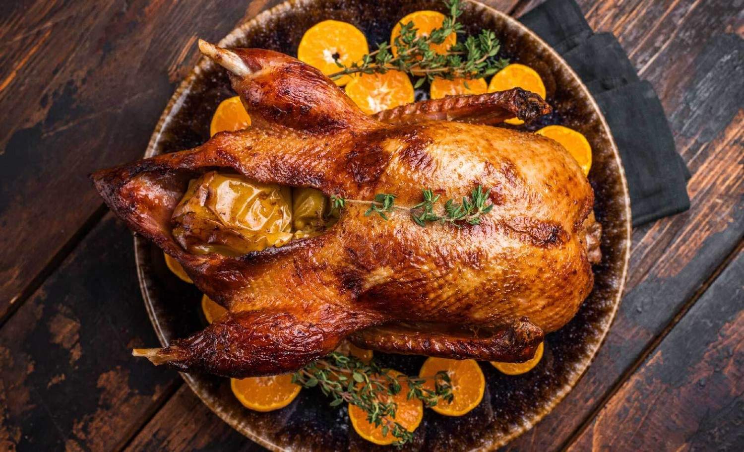 a stock photo of crispy duck with orange glaze