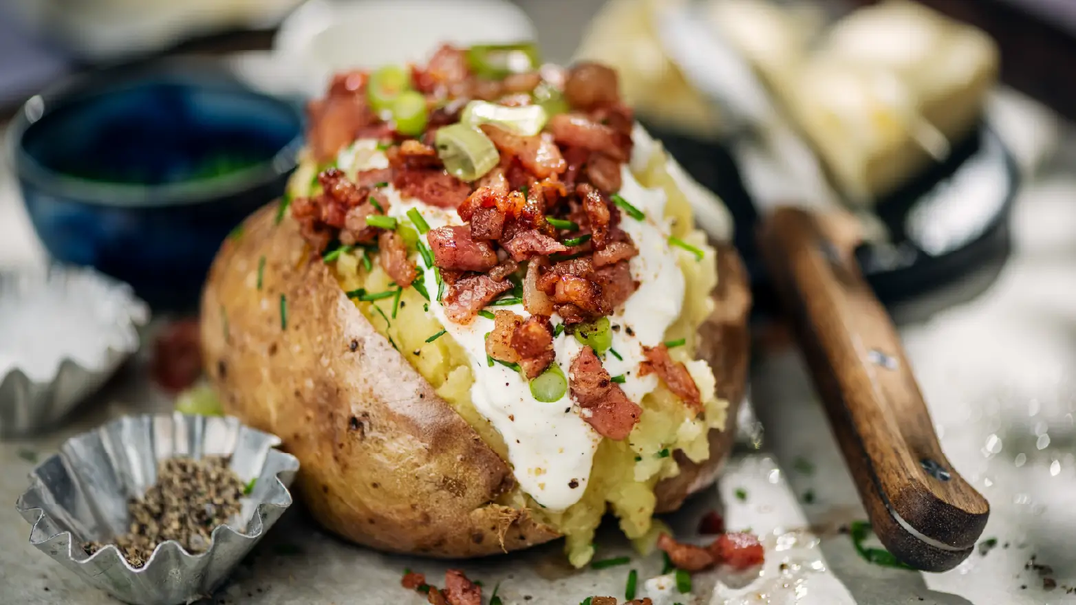 a baked potato with many toppings