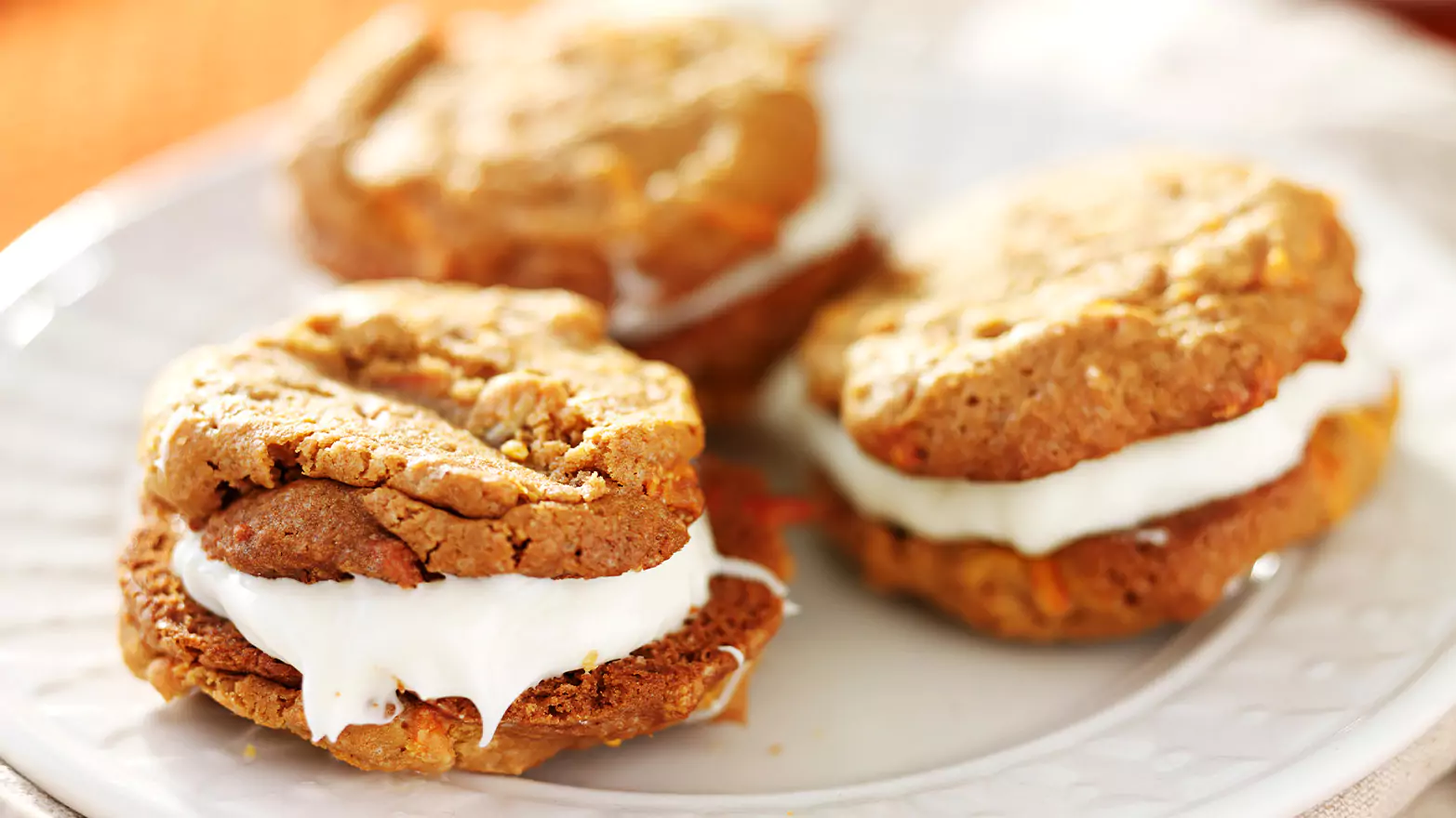 Pumpkin whoopie pies on a serving platter