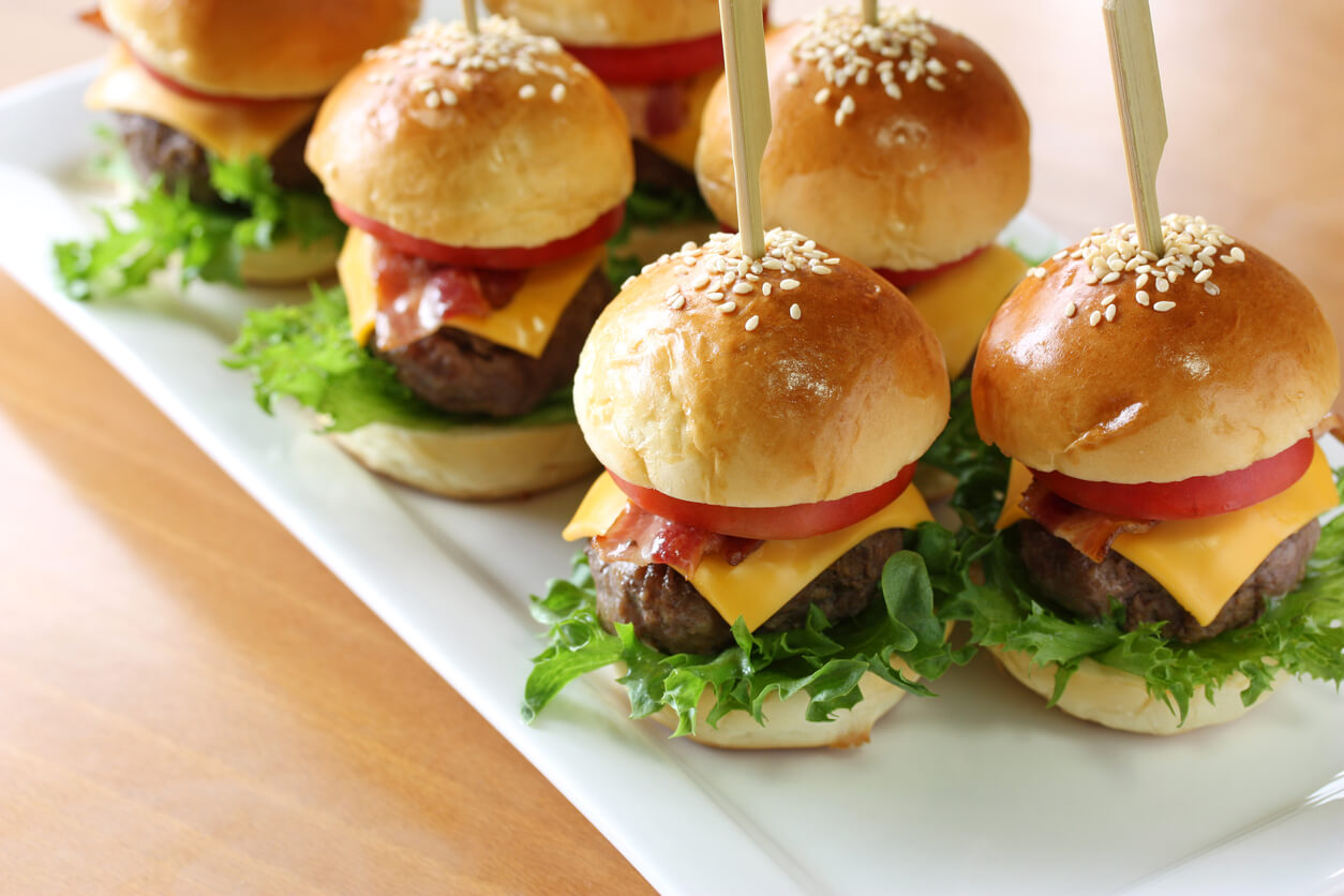mini hamburgers on a table.