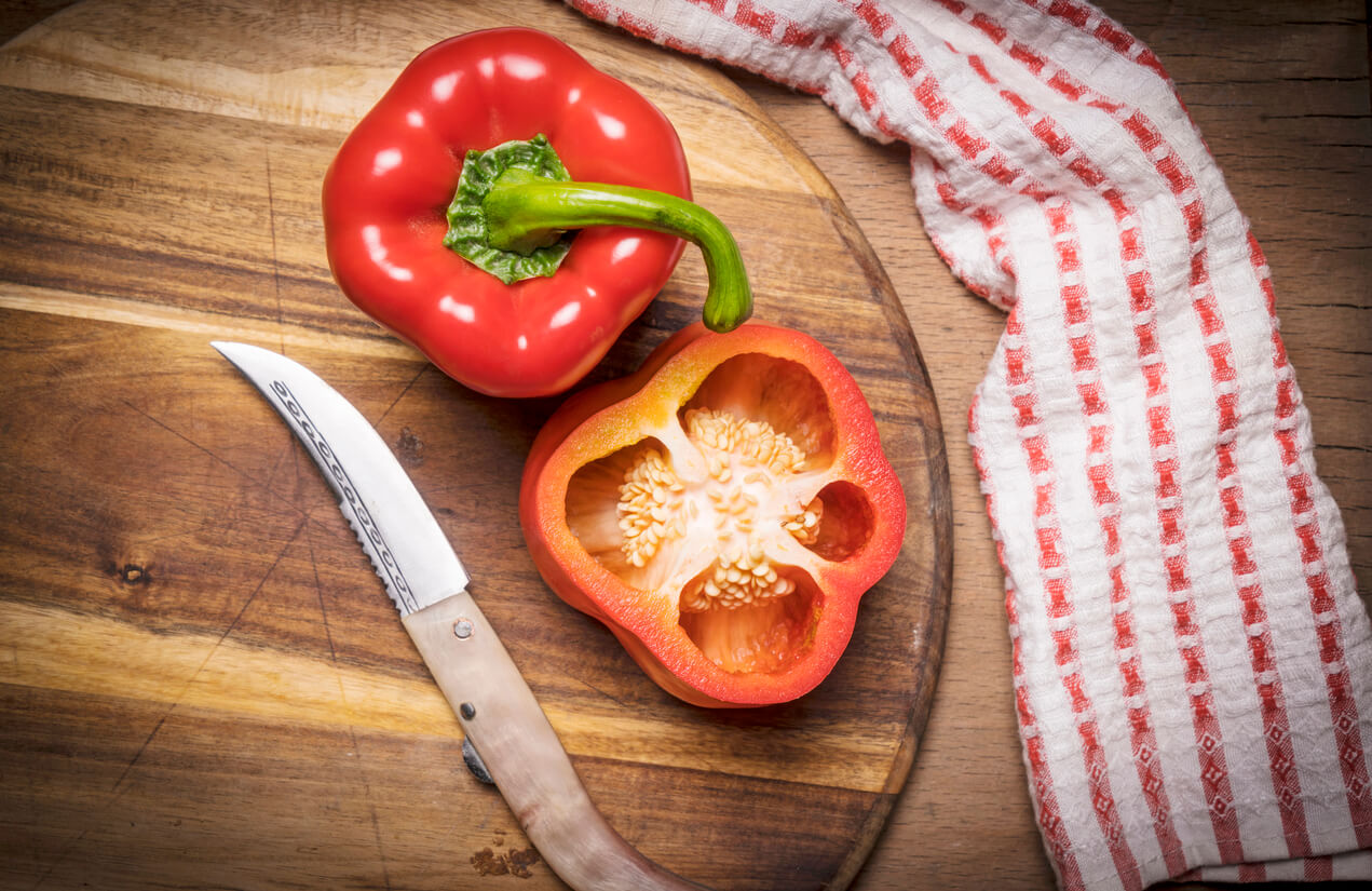 Red sweet peppers at kitchen.