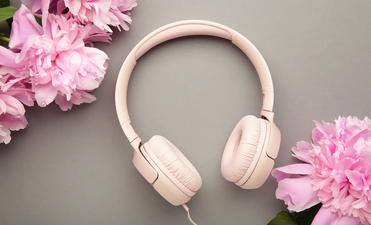 A photo of pink headphones.