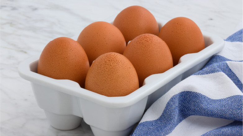 half a dozen brown eggs to make box cake better