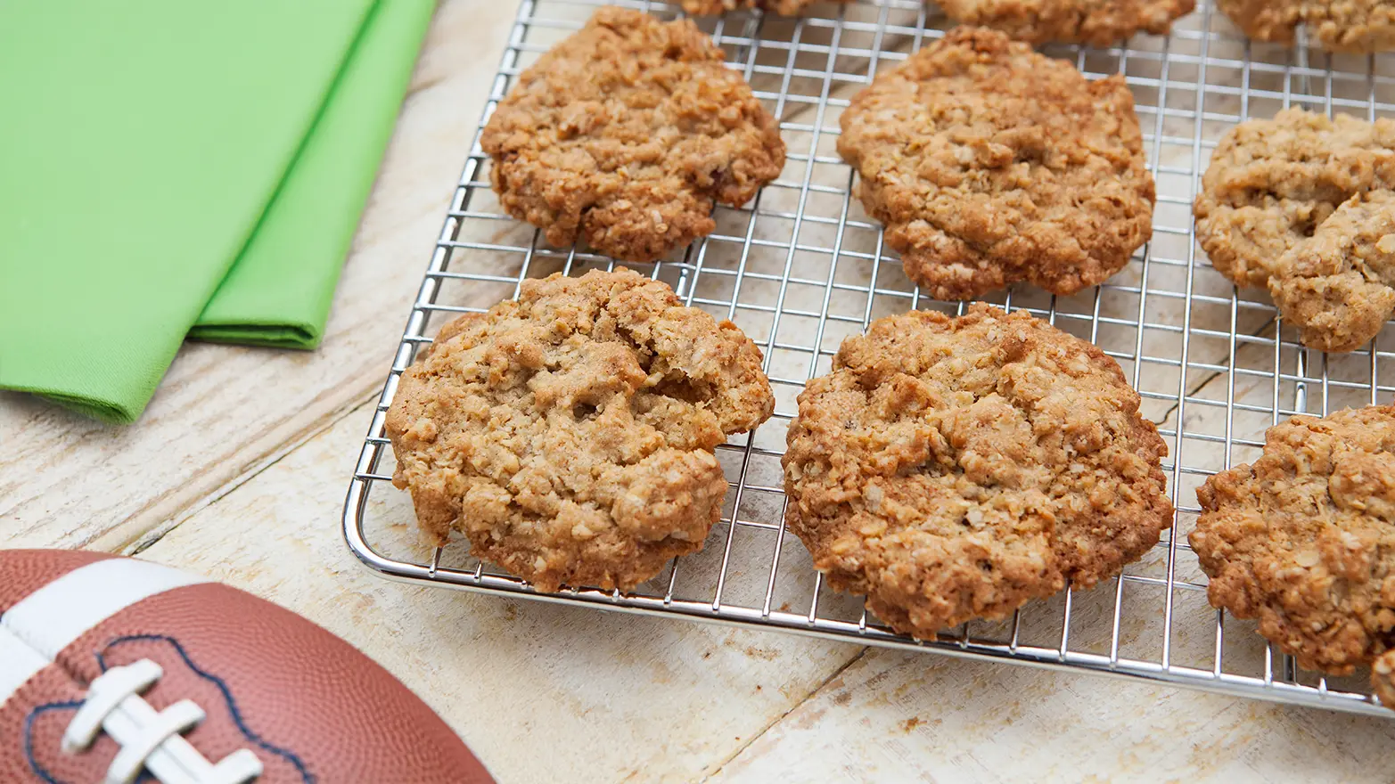 Oatmeal cookies on a cooling rack before a football party.