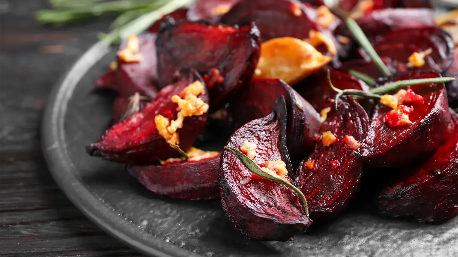Roasted beet slices with garlic and rosemary.
