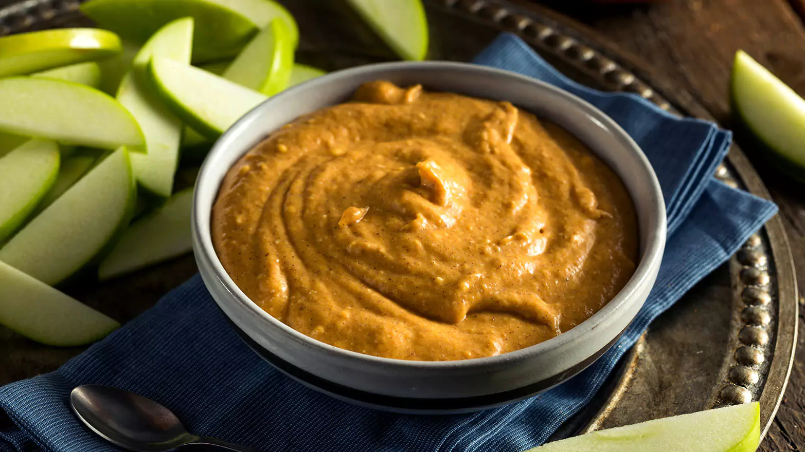 Sweet pumpkin fluff dip served with green apple slices