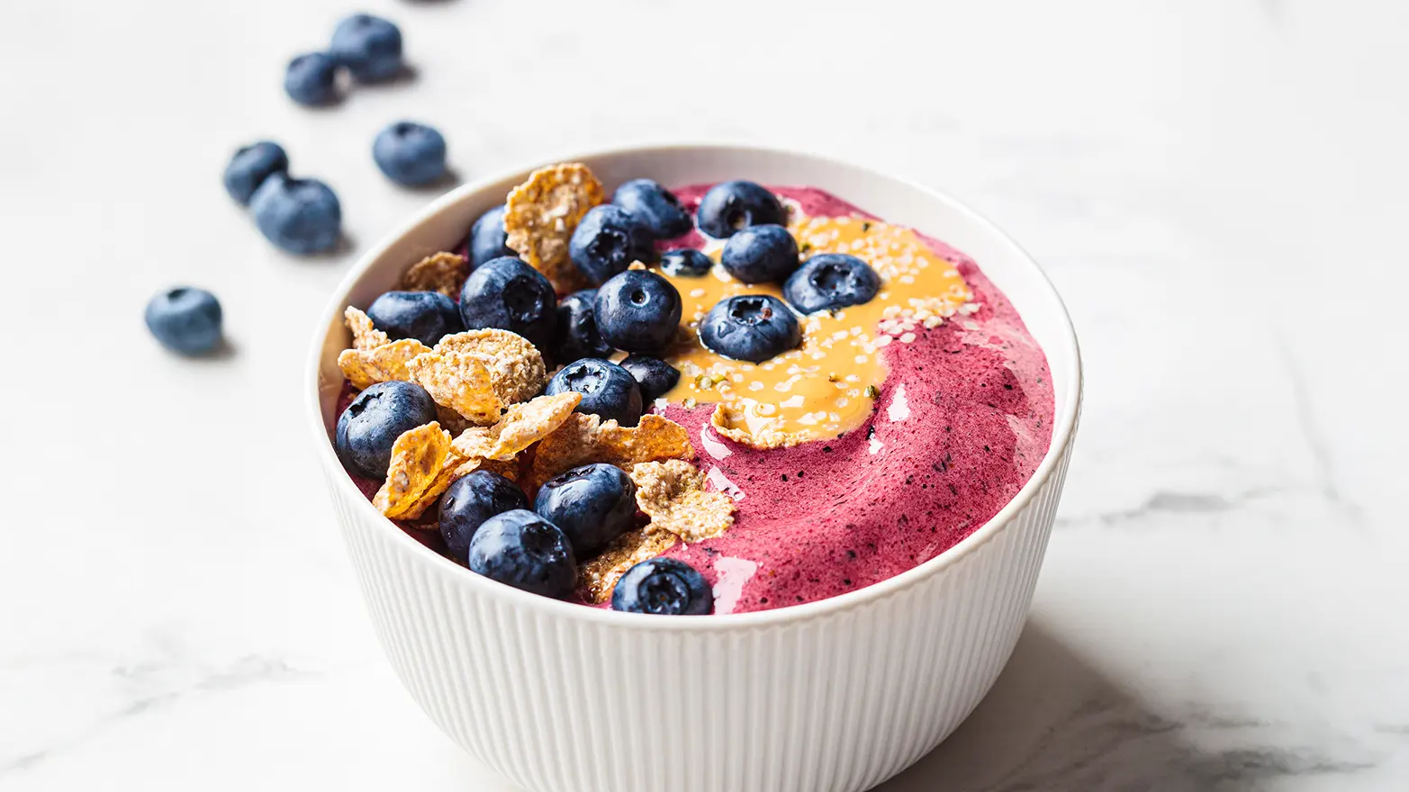 Photo of blueberry almond butter smoothie bowl