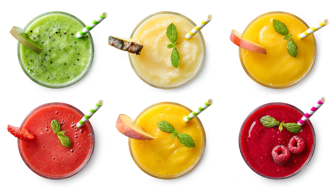 Set of various fresh fruit smoothies isolated on white background.