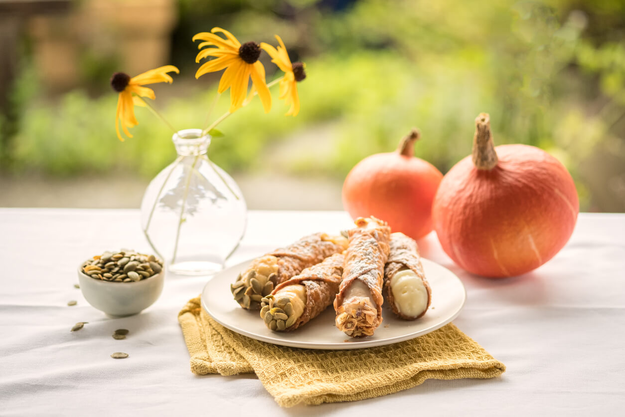 Traditional Italian/Sicilian dessert garnished with pumpkin seeds and sliced hazelnuts.